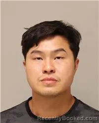 Mugshot of Kevin Chue Fue Her booked in Anoka County, Minnesota on July 29, 2026