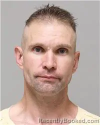 Mugshot of ERIK REID BENSON booked in Anoka County, Minnesota on August 4, 2026