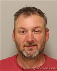 Mugshot of Travis Joseph Amiot booked in Anoka County, Minnesota on October 9, 2026