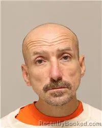 Mugshot of John Claude Tharrett booked in Anoka County, Minnesota on October 10, 2026