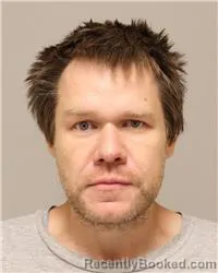 Mugshot of Justin Robert Holzmer booked in Anoka County, Minnesota on October 19, 2026