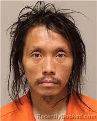 Mugshot of Kou Her booked in Anoka County, Minnesota on October 22, 2026