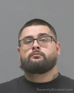 Mugshot of Damian Alfonso Harroun Carrera booked in Blue Earth County, Minnesota on August 13, 2026