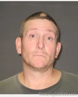 Mugshot of JASON DUANE OLSCHLAGER booked in Clay County, Minnesota on April 30, 2026