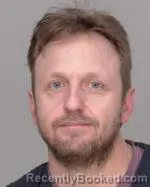 Mugshot of Clarence Michael Olson
