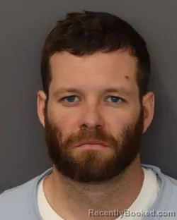 Mugshot of ZACHARY DAVID RHEDIN booked in Dakota County, Minnesota on March 18, 2026