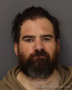 Mugshot of MARCUS JON OLSON booked in Dakota County, Minnesota on March 18, 2026