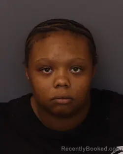 Mugshot of Unique Tenisha Flowers booked in Dakota County, Minnesota on June 15, 2026