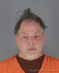 Mugshot of TOM NEAL SCOLAIDHE ASHBURN booked in Hennepin County, Minnesota on April 16, 2026
