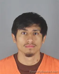 Mugshot of DANIEL AGUILAR ALBINO booked in Hennepin County, Minnesota on April 16, 2026