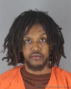 Mugshot of ABDIASIS KHALIF MOHAMUD booked in Hennepin County, Minnesota on April 18, 2026
