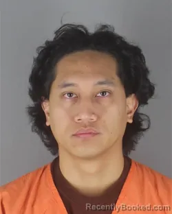 Mugshot of GERRY JAMES ALARCIO booked in Hennepin County, Minnesota on April 20, 2026