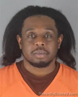 Mugshot of ARON RASHID TITUS OWENS booked in Hennepin County, Minnesota on April 21, 2026