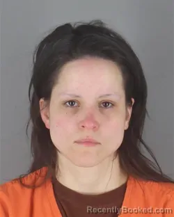 Mugshot of TESS LYUBOV ROMAN booked in Hennepin County, Minnesota on April 25, 2026