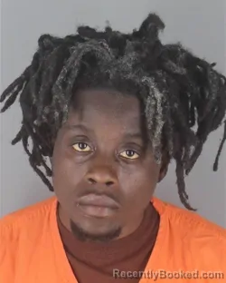 Mugshot of TROKON DANIEL KPASIE booked in Hennepin County, Minnesota on April 25, 2026