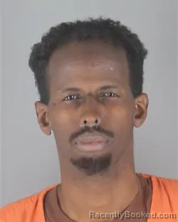 Mugshot of HUSSEIN ABDI HIRE booked in Hennepin County, Minnesota on May 3, 2026