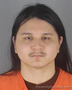 Mugshot of THOMAS THIRAPONG WENUM booked in Hennepin County, Minnesota on May 4, 2026