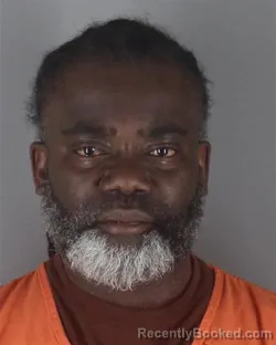 Mugshot of ERIC KOFI NYAME booked in Hennepin County, Minnesota on May 4, 2026
