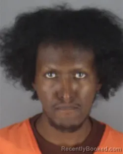 Mugshot of ABDIKAFI ALI HUSSEIN booked in Hennepin County, Minnesota on May 7, 2026