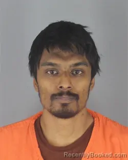 Mugshot of DAVIN ARUNASALAM booked in Hennepin County, Minnesota on May 8, 2026