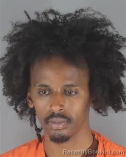 Mugshot of AHMAD ABDULNASIR AHMAD booked in Hennepin County, Minnesota on May 8, 2026