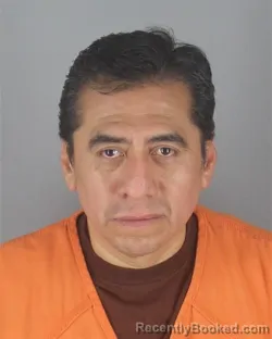 Mugshot of MARCOS OLIVERA BENITEZ booked in Hennepin County, Minnesota on May 9, 2026