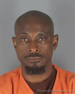 Mugshot of ADETOKUNBO OLUBUNMI ADEJUMO booked in Hennepin County, Minnesota on May 10, 2026