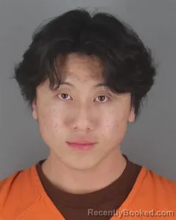 Mugshot of QUINSTIN TOUKING YANG booked in Hennepin County, Minnesota on May 10, 2026