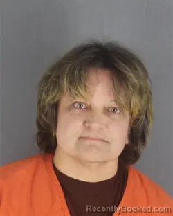 Mugshot of LORA LYNN FELDMANN booked in Hennepin County, Minnesota on May 13, 2026