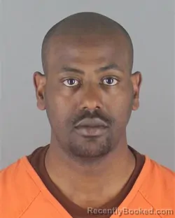 Mugshot of MOTI DUGASSA ABDISSA booked in Hennepin County, Minnesota on May 13, 2026