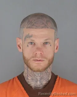 Mugshot of TRAVIS RYAN RAYMOND booked in Hennepin County, Minnesota on May 14, 2026