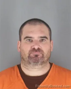 Mugshot of MARCUS JOHN OLSON booked in Hennepin County, Minnesota on May 15, 2026