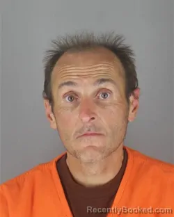 Mugshot of JOSHUA ADAM TRENT booked in Hennepin County, Minnesota on June 24, 2026