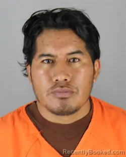 Mugshot of CLAUDIO ORLANDO MASAQUIZA CAISABANDA booked in Hennepin County, Minnesota on June 25, 2026