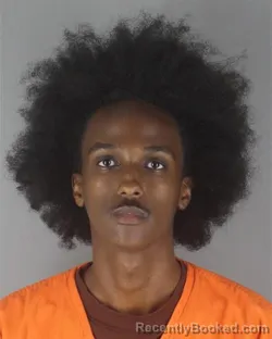 Mugshot of MOHAMED IBRAHIM ABDI booked in Hennepin County, Minnesota on June 26, 2026