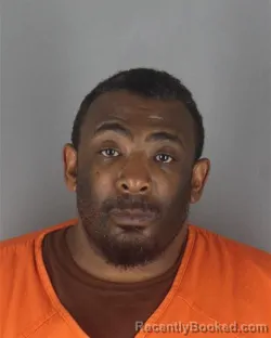 Mugshot of RAYMOND XAVIER HENDERSON booked in Hennepin County, Minnesota on July 1, 2026