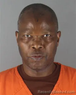 Mugshot of KEFA NYAMWAKA ASUGA booked in Hennepin County, Minnesota on July 6, 2026