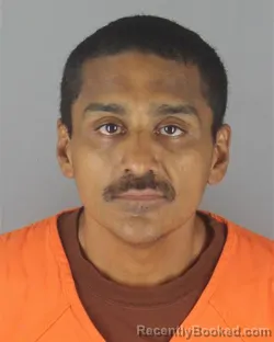Mugshot of ALEJANDRO GONZALEZ booked in Hennepin County, Minnesota on July 8, 2026