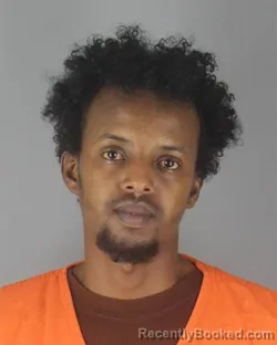 Mugshot of ABDIHAKIN MUHUMED DEK booked in Hennepin County, Minnesota on July 9, 2026