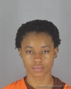 Mugshot of Jenesis Alise Powell booked in Hennepin County, Minnesota on August 7, 2026