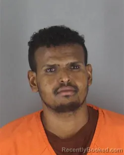 Mugshot of Ali Abukar Hassan booked in Hennepin County, Minnesota on August 7, 2026