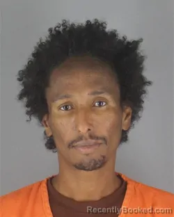 Mugshot of Ahmed Mohamed Mahdi booked in Hennepin County, Minnesota on August 7, 2026