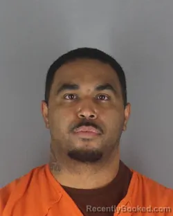Mugshot of Raphael Joseph Rodriquez booked in Hennepin County, Minnesota on August 7, 2026