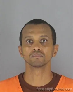 Mugshot of Adnan Bascir Osman booked in Hennepin County, Minnesota on August 7, 2026