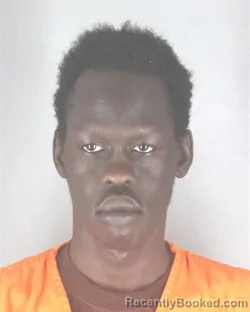 Mugshot of Jal Chol Dhul booked in Hennepin County, Minnesota on August 8, 2026