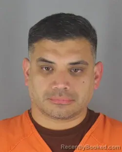 Mugshot of Mauro Burgos booked in Hennepin County, Minnesota on August 9, 2026