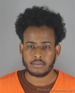 Mugshot of Abdirahman Yusuf Mohamud booked in Hennepin County, Minnesota on August 11, 2026