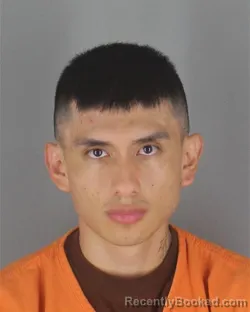 Mugshot of John Alex Rodriguez Pungana booked in Hennepin County, Minnesota on August 12, 2026