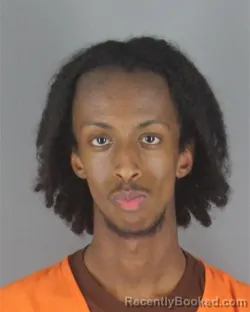 Mugshot of Adan Abdi Ali booked in Hennepin County, Minnesota on August 21, 2026