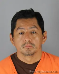 Mugshot of Alberto Salomon Tenesaca Lema booked in Hennepin County, Minnesota on August 24, 2026